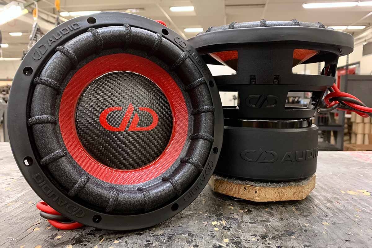 Two USA made subwoofers with red carbon fiber cones, black carbon fiber dust caps and red DDA logos