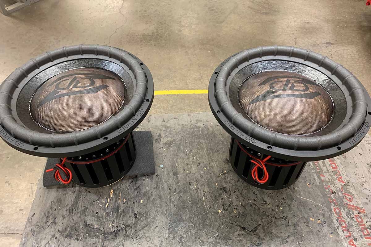 Two USA Made Subwoofers with black cones, polychromatic copper dust caps and black DD Z logos