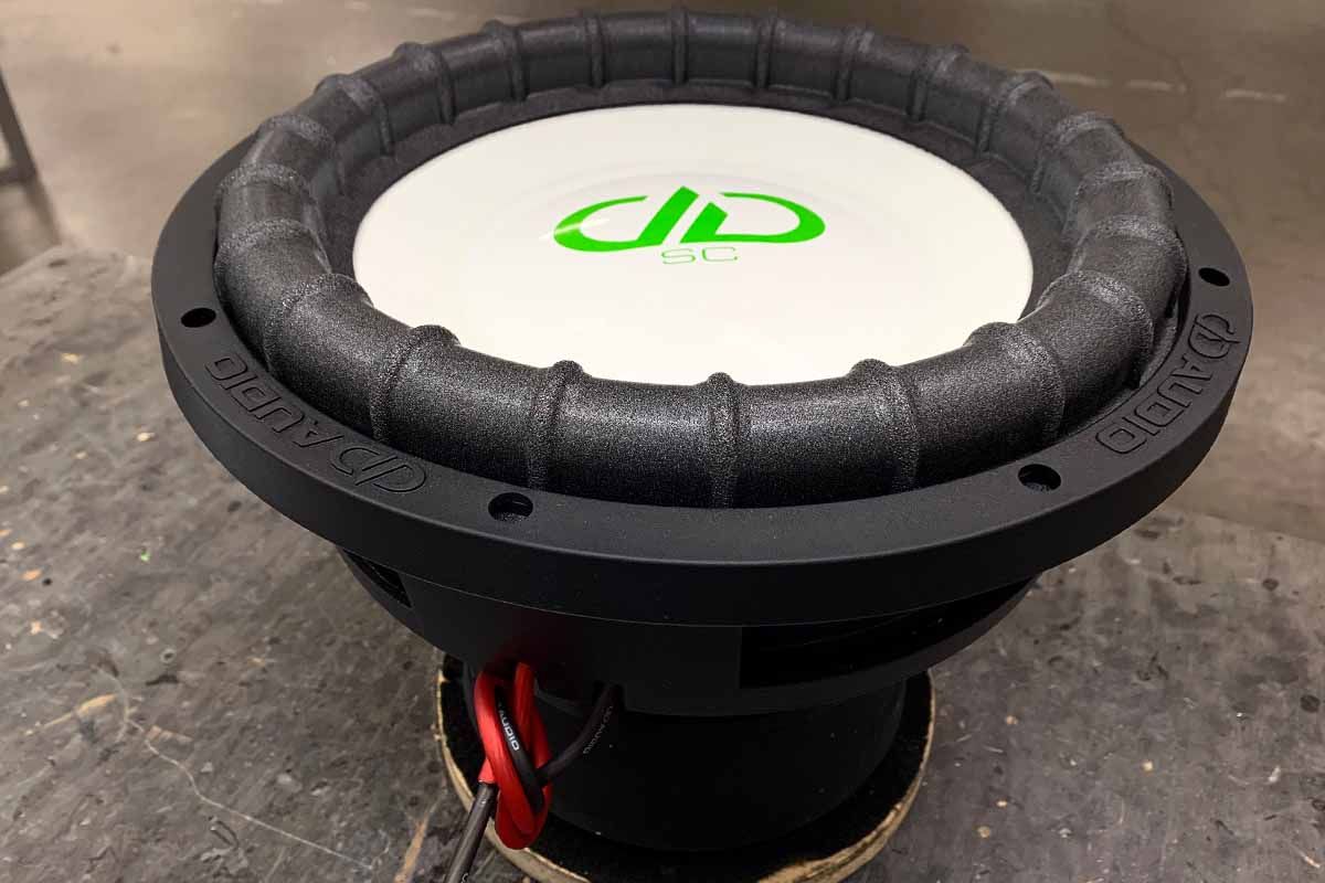 USA Made Subwoofer with white cone, white dust cap, green DDA logo and green Super Charged decal