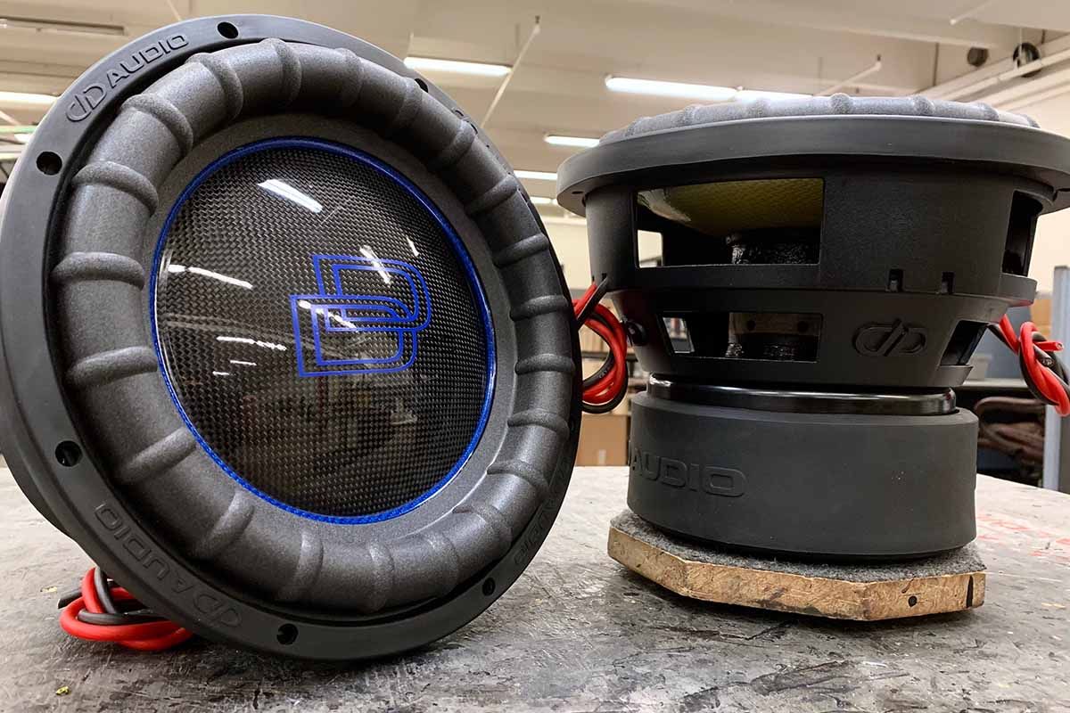 Two USA Made subwoofers with blue carbon fiber cone, high gloss black carbon fiber dust cap and blue DD classic logo