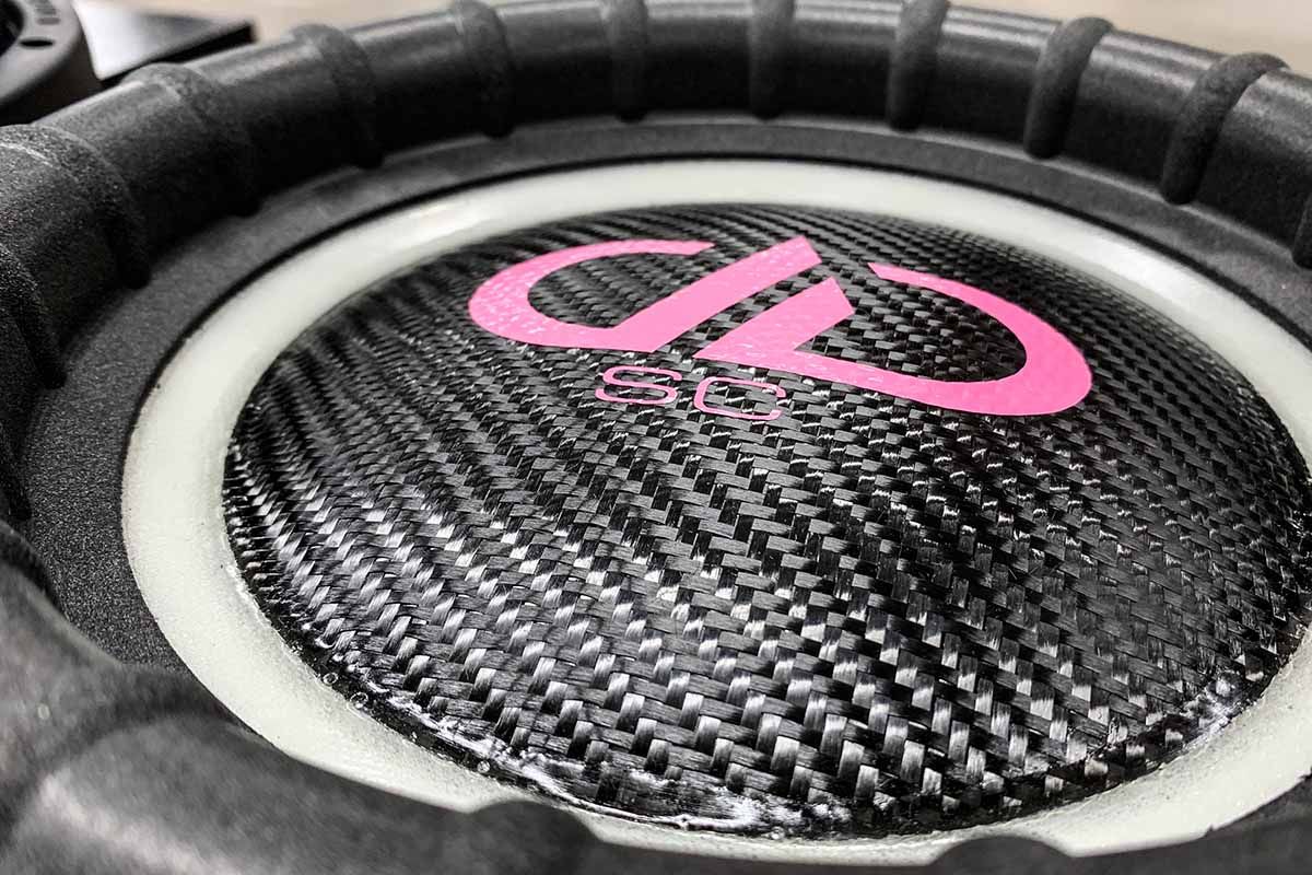 USA Made Subwoofer with ghost cone, black carbon fiber dust cap, pink DDA logo and pink super charged decal