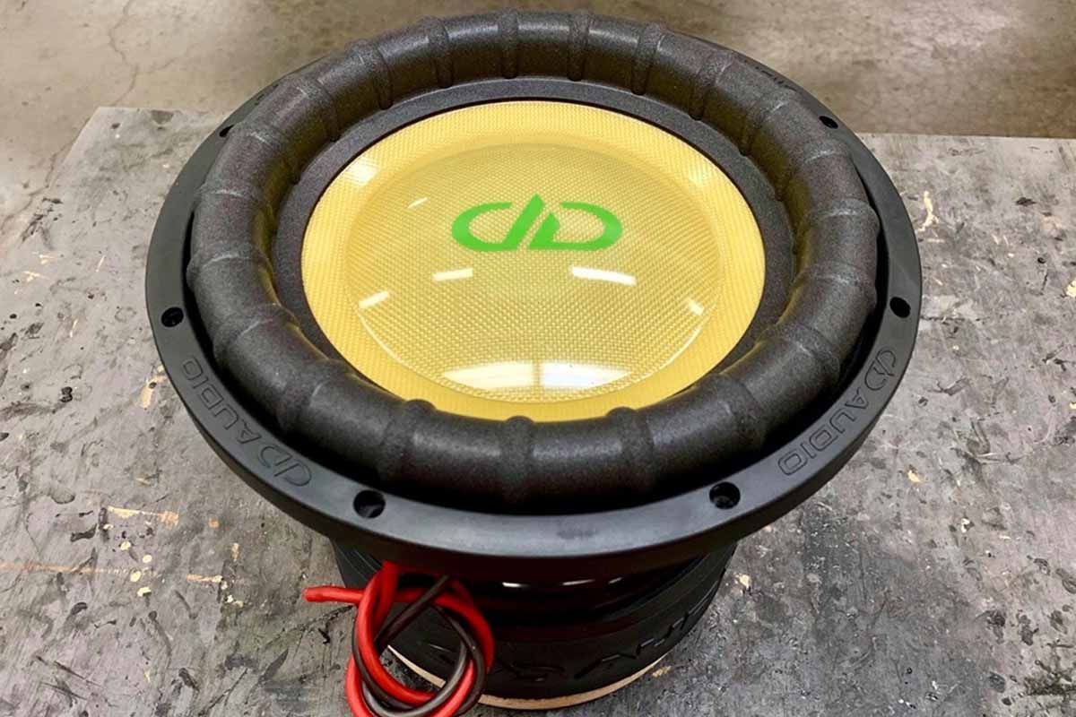 USA Made Subwoofer with yellow cone, yellow high gloss dust cap, and green DDA logo