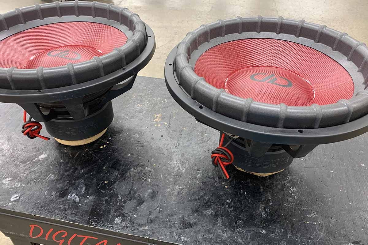 Two USA Made Subwoofers with red cones, red dustcaps, and blog DDA logos