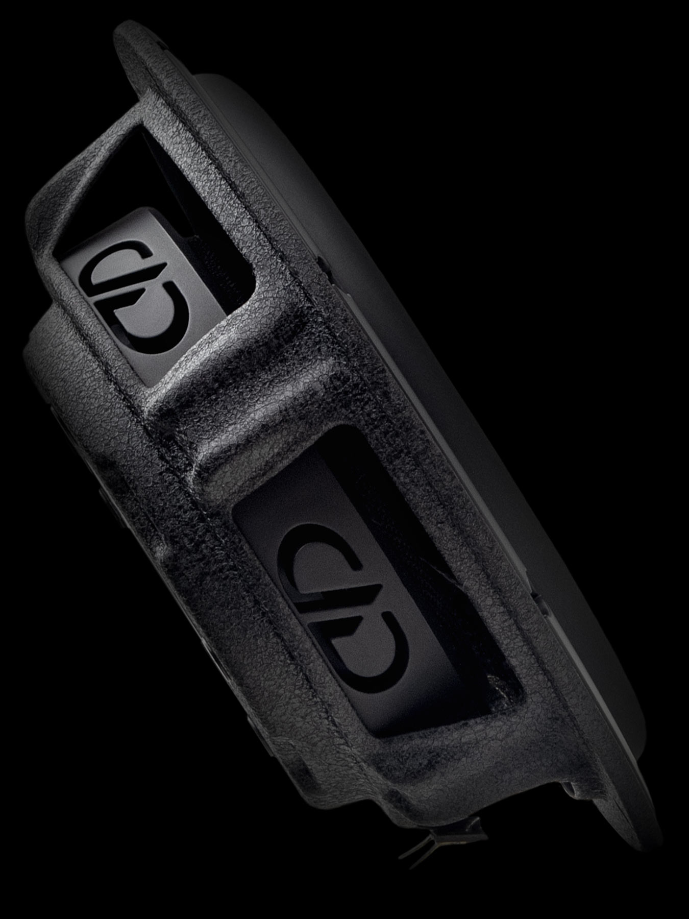 Stylized close-up of woofer basket with DD logo venting