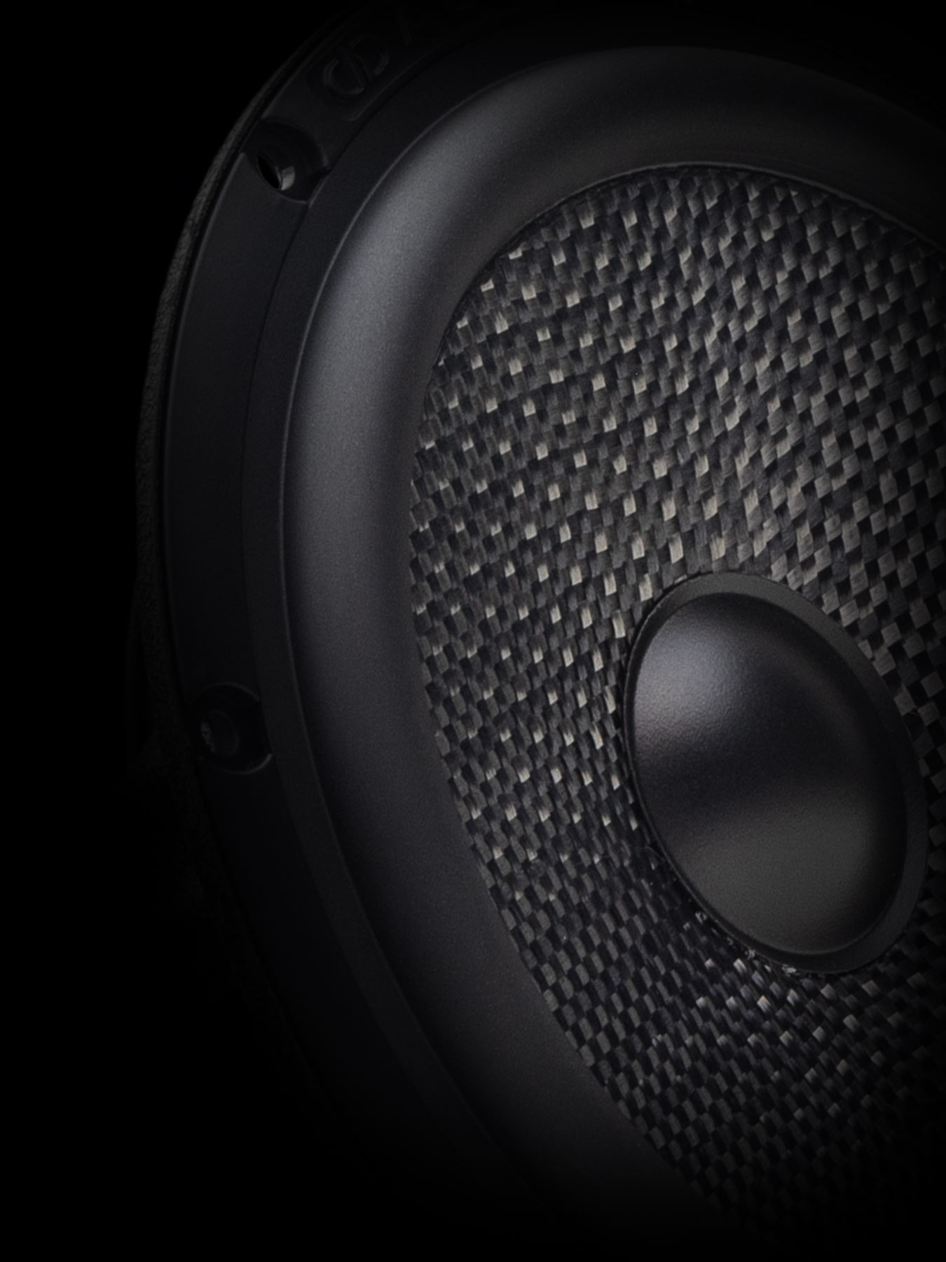 Stylized close-up of woofer cone surround, cone, and dustcap