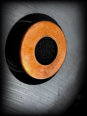 Stylized close-up of woofer shorting ring